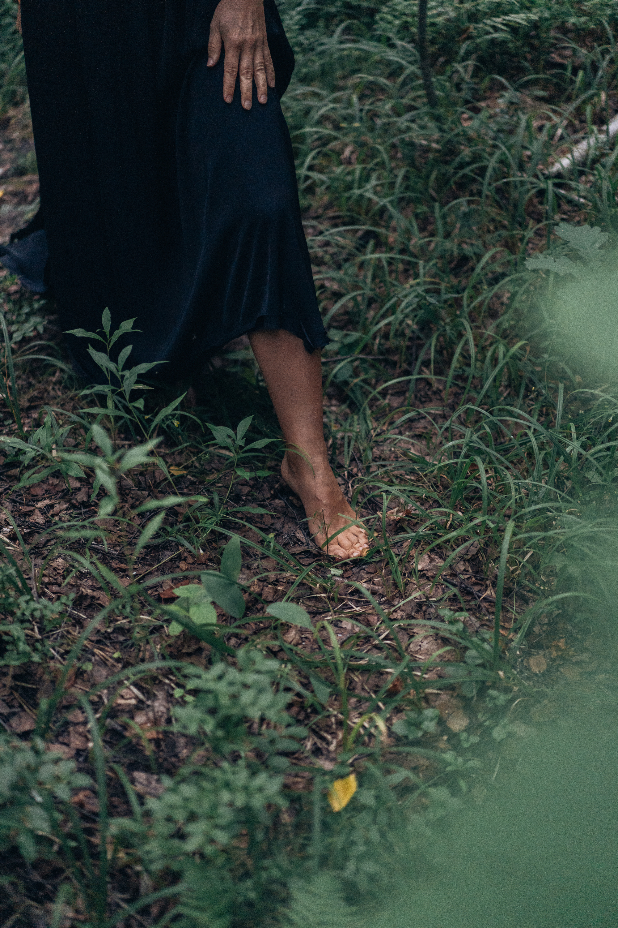 Woman Standing Barefooted in the Forest